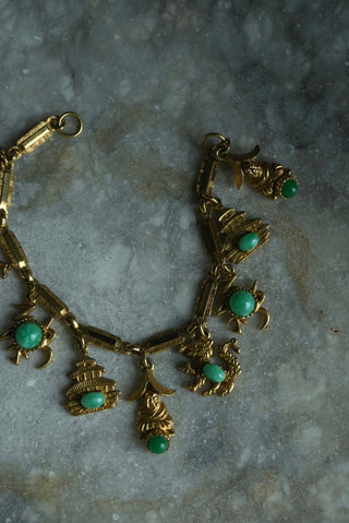 CHARMED LIFE - GOLDTONE  CHARM BRACELET