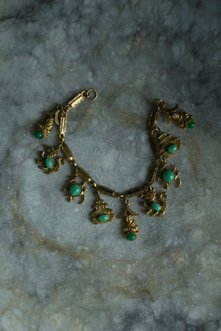 CHARMED LIFE - GOLDTONE  CHARM BRACELET